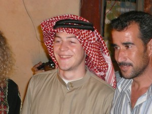 The author (left), wearing traditional Jordanian keffiyah, together with Eisa Dweiket, who hosted the group at his home