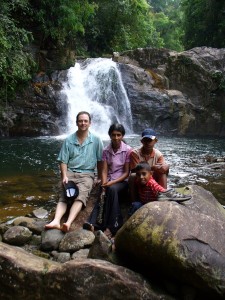 The author poses with his homestay hosts during a hike with them in Sri Lanka's Sinharaja rainforest.