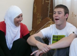 The author (right) and Dima share a joke over lunch in a family home in Orjan village, Jordan